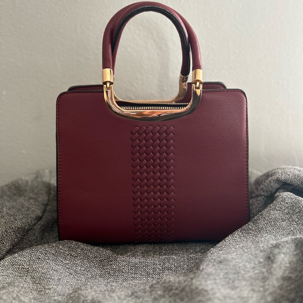 Elegant Burgundy Handbag with Gold Accents
